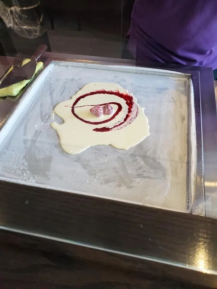 Making rolled ice cream, a Thai street food 